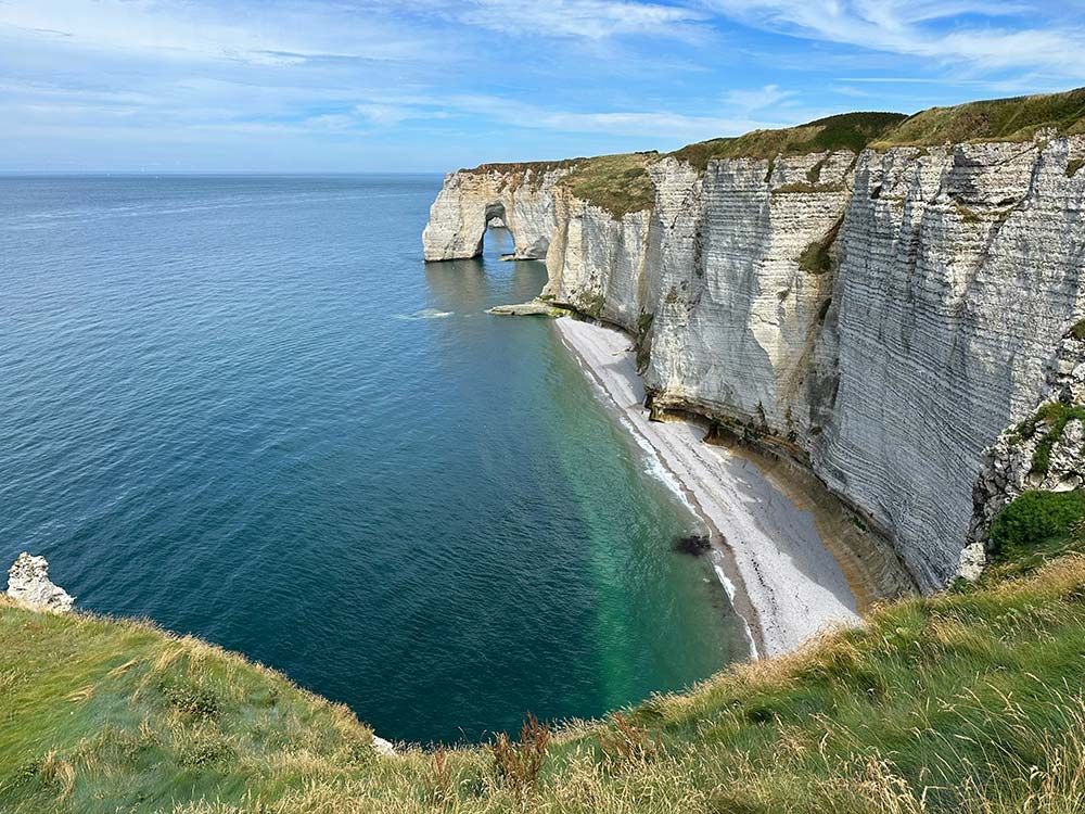 cliffs and the sea under a bright blue sky