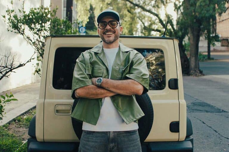 Smiling man with crossed arms