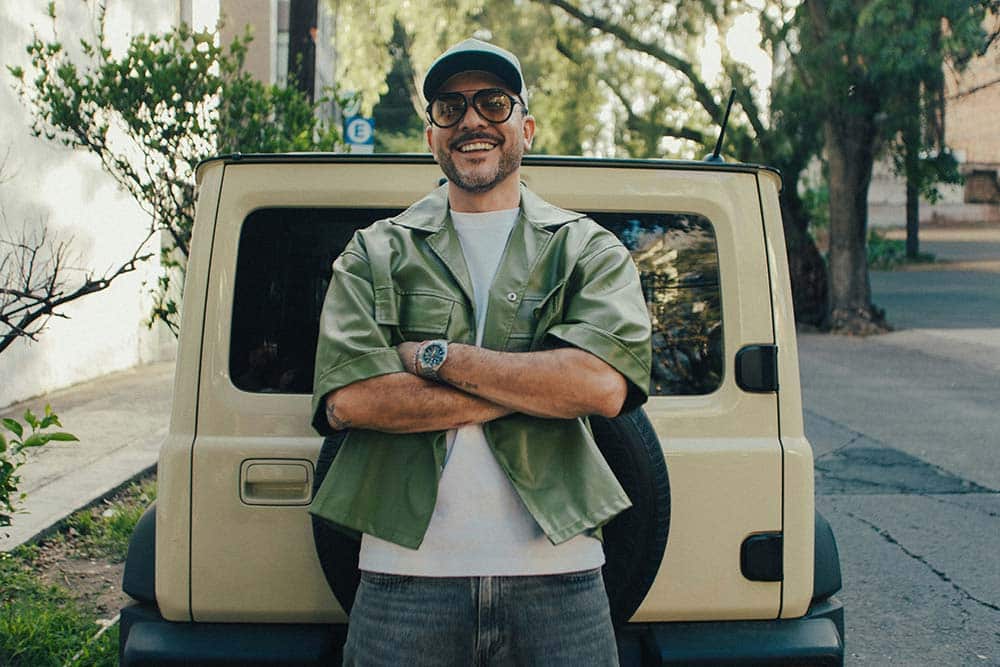 Smiling man with crossed arms